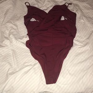 A waist cutout wrap bodysuit.